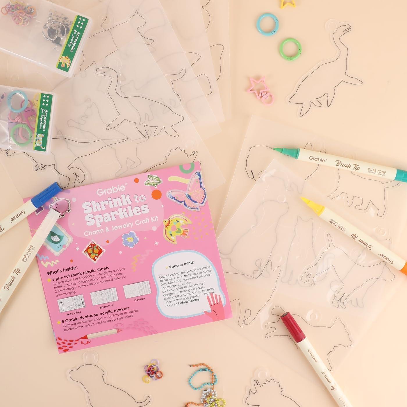 image:imageGrabie DIY Shrink Art Craft Kit Jewelry Making Kit for Kids Adults 25 PreCut Shapes 5 DualTip Markers Custom Charms Pins Rings Keychains Paws amp Wings Creative FreedomPaws Wings Creative Freedom